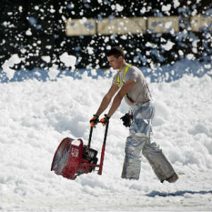 worker removing snow